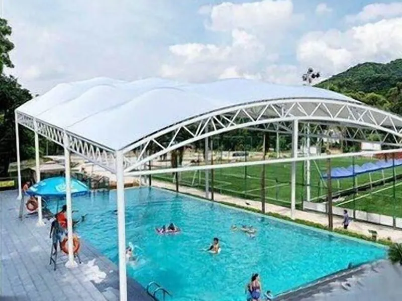 Arched membrane roof over a swimming pool