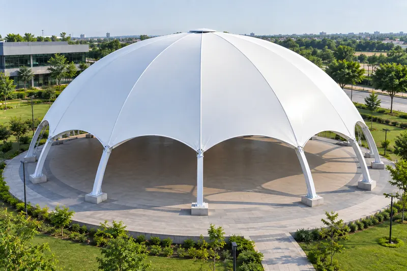 Gored tensile membrane dome with arched steel ribs over an open plaza